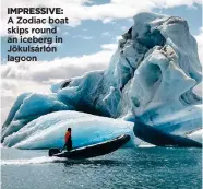  ??  ?? IMPRESSIVE: A Zodiac boat skips round an iceberg in Jökulsárló­n lagoon