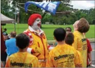  ?? MARIAN DENNIS – DIGITAL FIRST MEDIA ?? Ronald McDonald entertains a group of kids at the 19th annual Soap Box Derby Challenge race.