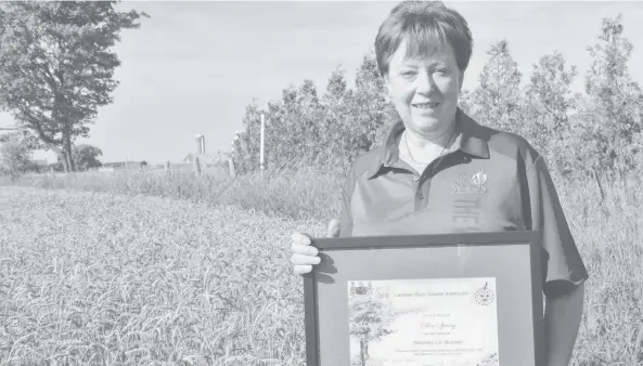  ?? [VERONICA REINER / THE OBSERVER] ?? Crop developmen­t has been a lifelong passion for Elmira’s Ellen Sparry, with her efforts to make advances in the field being recognized with the Honorary Life Award from CSGA.