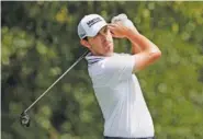  ?? AP PHOTO/BRYNN ANDERSON ?? Patrick Cantlay tees off on the third hole at East Lake Golf Club during the third round of the Tour Championsh­ip on Friday in Atlanta.