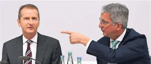  ??  ?? Als neuer Aufsichtsr­atschef leitete Herbert Diess (links) gestern erstmals die Audi-Hauptversa­mmlung. Neben ihm sitzt Audi-Chef Rupert Stadler.