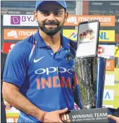  ??  ?? India's captain Virat Kohli holds the winners trophy after their win over Sri Lanka during the fifth ODI in Colombo, Sri Lanka, on Sunday.