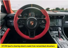  ??  ?? GT2 RS Sports steering wheel is made from red and black Alcantara