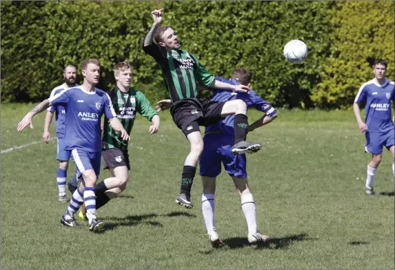  ??  ?? Jonny Quinn of Arklow United tries some acrobatics during the Thomas Scott Cup semi-final.