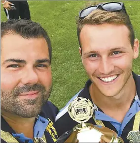  ??  ?? Ben Patterson, right, shares a smile with Serge Conein as they hold up the trophy in Sweden. PHOTO: SUPPLIED.