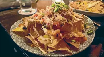  ?? STEPHEN HEARD/STUFF ?? Lobster nachos are the order of the day at The Office.