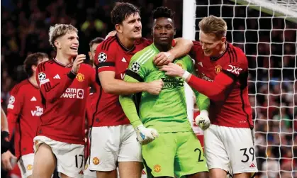  ?? ?? Manchester United celebrate after André Onana’s late penalty save against Copenhagen. Photograph: Richard Sellers/Getty Images/ Allstar