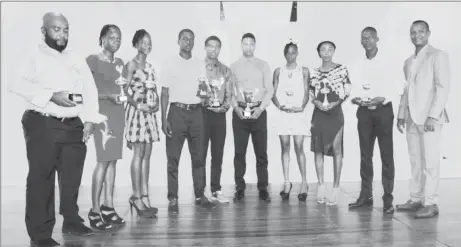  ??  ?? The recipients of the AAG’s award ceremony posing with their spoils on Saturday night at YMCA on Thomas Lands.