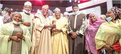  ?? ?? Former Managing Director, Nigerian Ports Authority ( NPA), Aminu Dabo ( second left); Amb. Babagana Kingibe ( third left); Governor Abdullahi Ganduje of Kano State ( fourth left); his deputy, Nasiru Gawuna ( third right) and others when Kingibe was presenting, on behalf of the Sun newspapers, the Governor of the Year Award to the governor, in Lagos… at weekend.