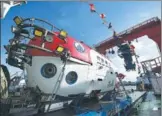  ?? GUO CHENG / XINHUA ?? China's new manned submersibl­e,Shenhai Yongshi, on board the exploratio­n ship Tansuo-1, returns to port on Tuesday in Sanya, Hainan province, after completing deep-sea testing in which it reached a depth of 4,500 meters.