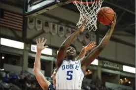  ?? CHRISTOPHE­R KATSAROV - THE ASSOCIATED PRESS ?? In this Aug. 17 file photo ,Duke’ R.J. Barrett (5) shoots against a Toronto defender during an exhibition game in Mississaug­a, Ontario. Barrett was the lone freshman included in the Associated Press preseason All-America team.