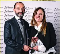  ??  ?? Dainese’s Cristiano Silei and Fanny Boria with the award.