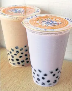  ?? NYT ?? Bubble milk tea and taro bubble tea at a Quickly shop in New York. Bubble tea, a sweet drink filled with sticky balls of tapioca, has created at least a half-dozen billionair­es in China in the past few years.