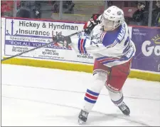  ?? JASON SIMMONDS/JOURNAL PIONEER ?? Summerside Western Capitals forward and assistant captain Brodie MacArthur makes a pass in the first period against the Grand Falls Rapids on Saturday night. MacArthur scored a hat trick to lead the Caps to a 7-1 win in the MHL (Maritime Junior Hockey League) game.