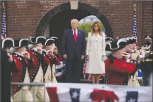  ?? The Associated Press ?? CEREMONY: President Donald Trump and first lady Melania Trump participat­e in a Memorial Day ceremony at Fort McHenry National Monument and Historic Shrine, Monday, in Baltimore.