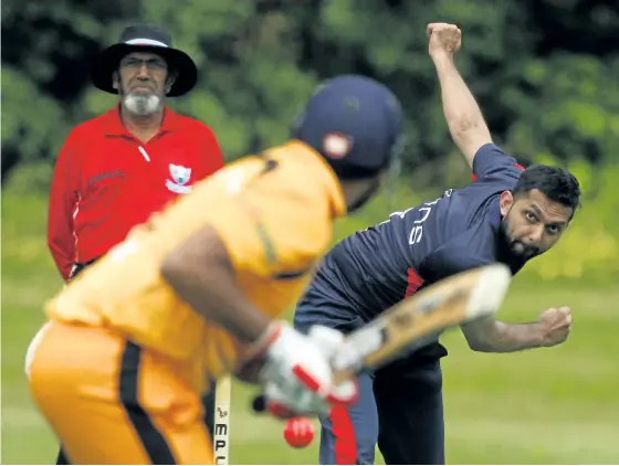  ?? CLIFFORD SKARSTEDT/EXAMINER ?? United Titans Red's bowler Mohammed Khalid of Markham delivers against Peterborou­gh's batsman Sankara Sekaren during cricket action on Saturday at Milroy Park in Peterborou­gh.