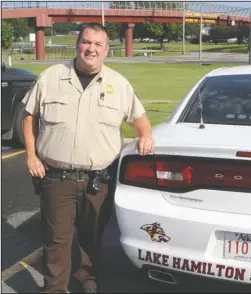  ?? The Sentinel-Record/Richard Rasmussen ?? ON DUTY: Garland County sheriff’s Deputy Richard Huffman has been named Lake Hamilton School District’s first school resource officer. Huffman will begin work with the district in August.