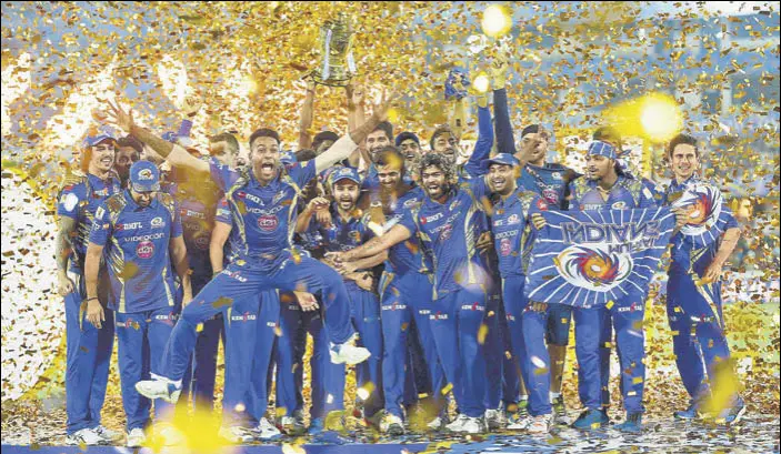  ?? PTI ?? Mumbai Indians players celebrate with the IPL trophy in Hyderabad on Sunday. This is Mumbai’s third IPL triumph, the most by a team.