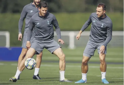  ??  ?? 0 Tottenham pair Jan Vertonghen, left, and Christian Eriksen prepare for the visit of Bundesliga winners Bayern Munich.