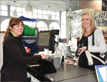  ??  ?? Lynda Murphy,left, serving one of Jones’ Eurospar’s loyal customers.