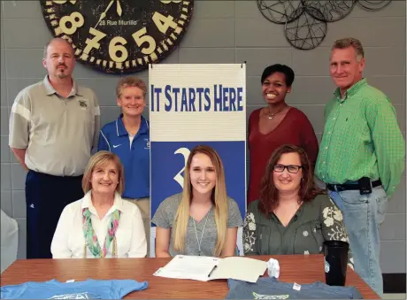  ??  ?? On hand to watch Mia Clark (seated, center) sign with the Georgia Northweste­rn Lady Bobcats were Gaye Johnson and Autumn Clark, Lady Bobcats’ head coach David Stephenson, Ringgold head coach Margaret Stockburge­r, Victoria Clemmons and Ray Johnson. (Catoosa County News photo/Scott Herpst)