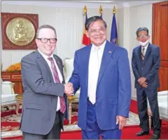  ?? SAR KHENG FB ?? Interior minister Sar Kheng shakes hands with ambassador Stefan Messerer on January 4.