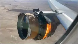 ?? The Associated Press ?? The engine of United Airlines Flight 328 is on fire after after experienci­ng “a rightengin­e failure” shortly after takeoff from Denver Internatio­nal Airport, Saturday.