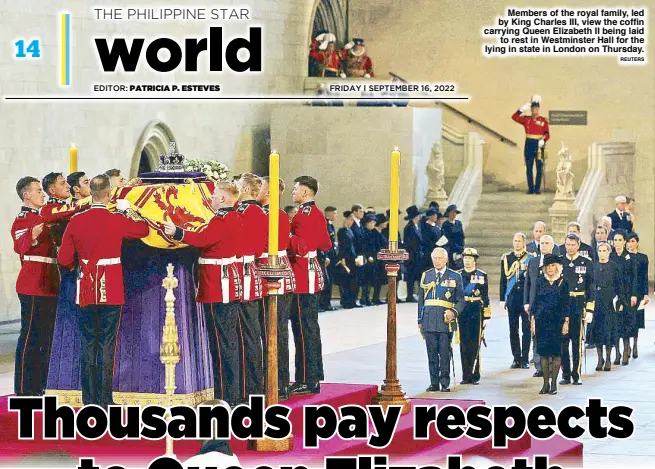  ?? REUTERS ?? Members of the royal family, led by King Charles III, view the coffin carrying Queen Elizabeth II being laid to rest in Westminste­r Hall for the lying in state in London on Thursday.