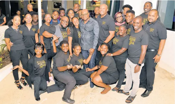  ??  ?? Organisers and members of the cast of ‘Jesus Christ Superstar’ who will perform next weekend at the Iberostar Suites, share lens time with Minister of Tourism Edmund Bartlett.