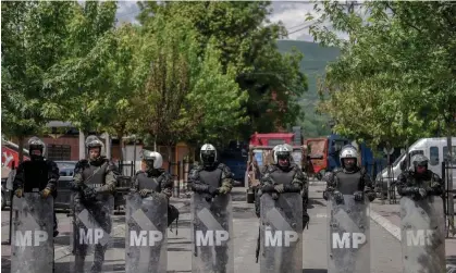  ?? Armend Nimani/AFP/Getty Images ?? Military police secure a town hall in Zvecan as Serb protesters demand the removal of recently elected Albanian mayors. Photograph: