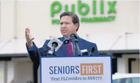  ?? BOB SELF/AP ?? Florida Gov. Ron DeSantis speaks at a news conference Wednesday at a Publix Super Market in Ponte Vedra Beach. DeSantis met with county leaders Tuesday in West Palm Beach to discuss rolling out the vaccine to more than 70 Publix stores in Palm Beach County.