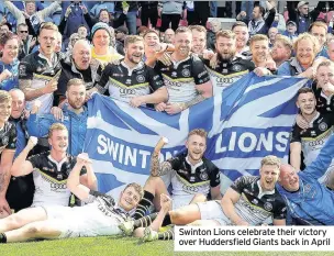  ??  ?? Swinton Lions celebrate their victory over Huddersfie­ld Giants back in April