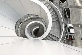  ??  ?? A spiral staircase connects three levels of outdoor spaces at the renovated Houston Center, downtown’s largest office complex.