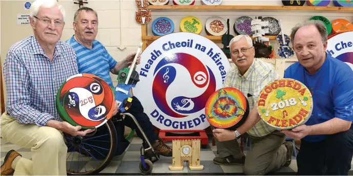 ??  ?? Jim Reynolds , Francis Genockey, Liam Reynolds and Peter Kiernan with some of the items made by the Men’s Sheds for the Fleadh Cheoil at their work place