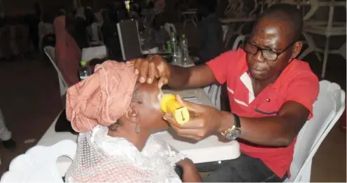  ?? Photo: NAN ?? A medical personnel attends to a patient during a four-day free medical eye-care programme sponsored by Offa Descendant Union, United Kingdom (UK) branch in Offa, Kwara State yesterday