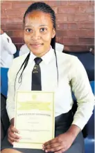  ??  ?? Mawande Gumede was presented with a certificat­e as one of the best in Grade 12