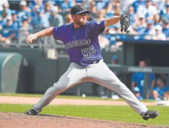  ??  ?? Rockies closer Greg Holland, pitching in the ninth inning Thursday against the Royals, posted his 36th save of the season after having several rough outings.