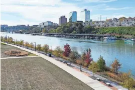  ?? RANDY SARTIN/SPECIAL TO THE NEWS SENTINEL ?? Between Sevier Avenue and the Tennessee River is Suttree Landing Park, a great place to relax between Big Ears Festival sets with a view of downtown Knoxville.