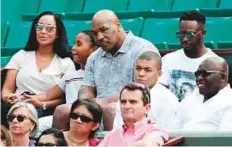  ?? AFP ?? Ex-world boxing champion Mike Tyson (top centre) and French footballer Kylian Mbappe (third from right) watch the action.