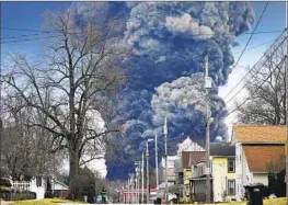  ?? Gene J. Puskar Associated Press ?? A CONTROLLED detonation after the train derailment releases a plume over East Palestine, Ohio. Republican­s have criticized President Biden for not visiting.