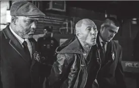  ?? STEFAN JEREMIAH, FILE/AP PHOTO ?? Weng Sor, center, is walked by New York Police Department detectives out of the 68th Precinct in the Brooklyn borough of New York on Tuesday. Sor, 62, the driver of a U-Haul truck that went on a miles-long rampage, barreling into bicyclists, moped riders, a police car and one pedestrian, was charged with murder in the death of delivery worker YiJie Ye.