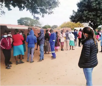  ??  ?? Residents queue to get vaccinated at Victoria Falls Hospital yesterday