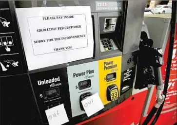  ?? Ben Margot Associated Press ?? AS OF LATE Wednesday, about half the stations in Virginia, South Carolina and Georgia had reported fuel outages, according to GasBuddy.com. Above, some pumps are dry at an Atlanta station after the cyberattac­k.