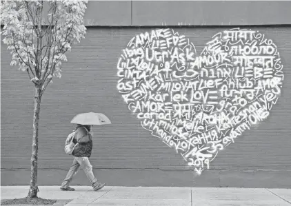  ?? NORTHJERSE­Y.COM FILE PHOTO ?? Many languages are reflected in artwork on a wall in downtown Englewood.