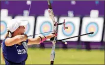  ?? (AP) ?? Reena Parnat, from Estonia, practices for the 2020 Summer Olympics at Yumenoshim­a Park Archery Field in Tokyo.