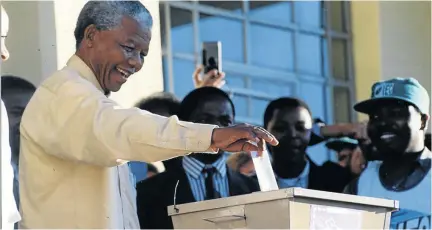  ?? /RICHARD SHOREY ?? Late former president Nelson Mandela casting his vote during the 1994 general elections at Inanda in Durban.