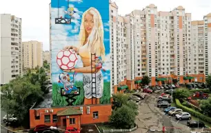  ?? — Reuters ?? A mural showing Daria Panteleeva is painted on an apartment building on the outskirts of Moscow.