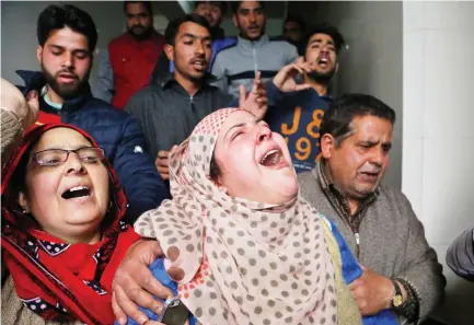  ??  ?? Relatives mourn the loss of a Kashmiri civilian in Srinagar on Tuesday. (AP)