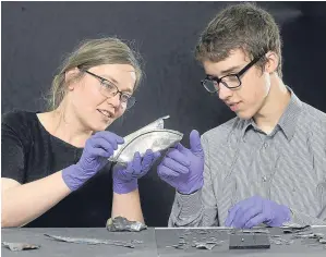  ?? Picture: Neil Hanna. ?? David Hall looks at some of the hoard with Glenmorang­ie research fellow, Alice Blackwell, the curator of the exhibition.