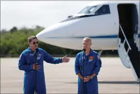  ?? AP PHOTO ?? NASA astronauts Robert Behnken (left) and Doug Hurley speak during a news conference after they arrived at the Kennedy Space Center in Cape Canaveral, Fla., Wednesday, May 20, 2020.